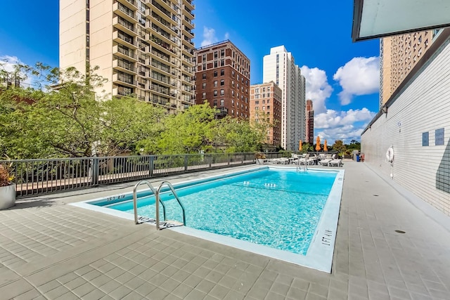 view of swimming pool with a patio area