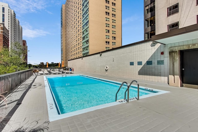 view of swimming pool with a patio area