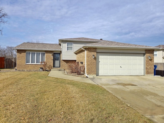 split level home featuring a front lawn, fence, concrete driveway, an attached garage, and brick siding