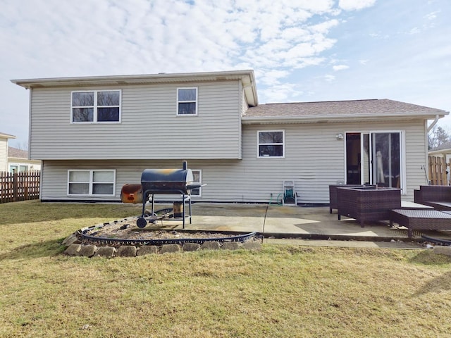 rear view of house with fence, a patio area, a lawn, and an outdoor hangout area