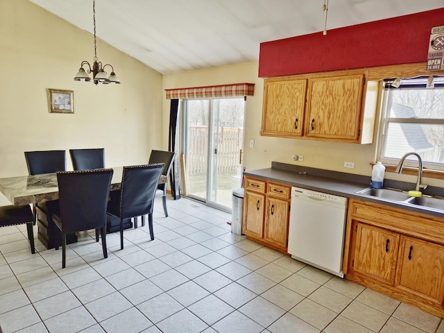 kitchen featuring sink, light tile patterned floors, hanging light fixtures, white dishwasher, and vaulted ceiling