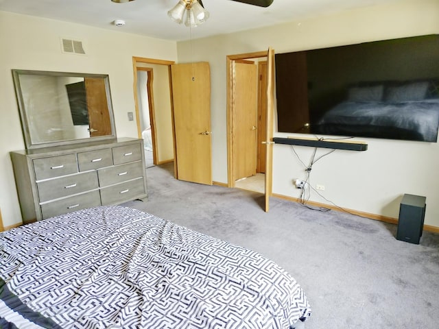 bedroom with visible vents, baseboards, a ceiling fan, and carpet flooring