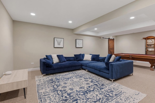 living room featuring carpet floors, recessed lighting, baseboards, and a barn door