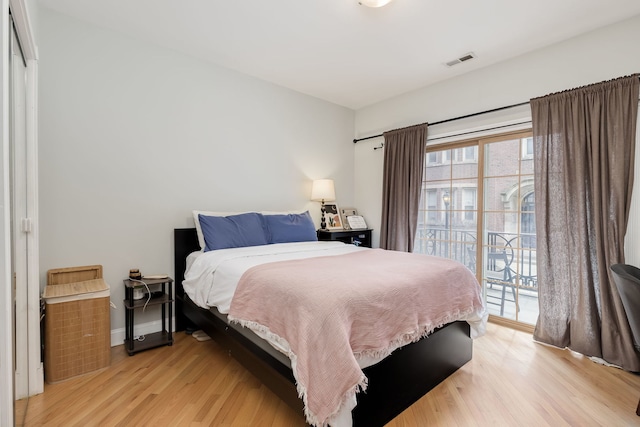 5331 S Harper Ave Unit 1, Chicago, IL 60615 - bedroom featuring light wood-style floors, visible vents, and access to exterior