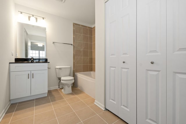 full bathroom with vanity, toilet, tiled shower / bath combo, and tile patterned flooring