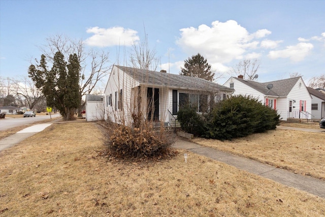 view of front of home with a front yard