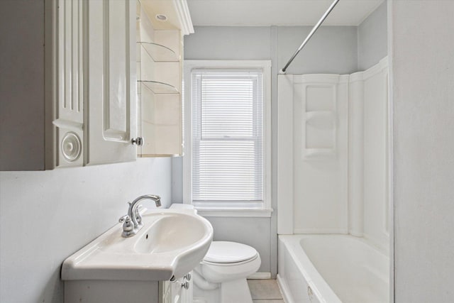 full bathroom featuring washtub / shower combination, vanity, toilet, and tile patterned floors