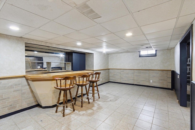 bar with a paneled ceiling