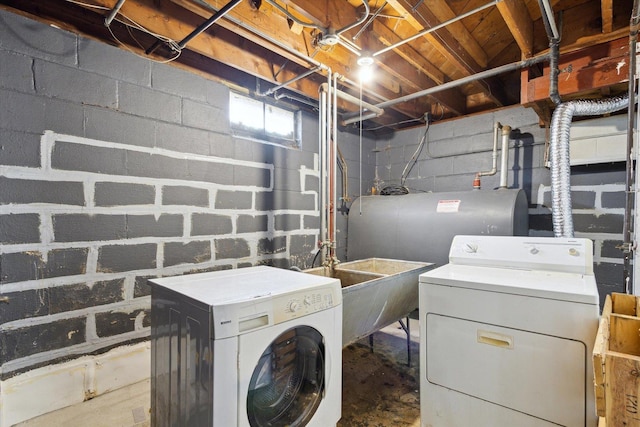 clothes washing area with separate washer and dryer