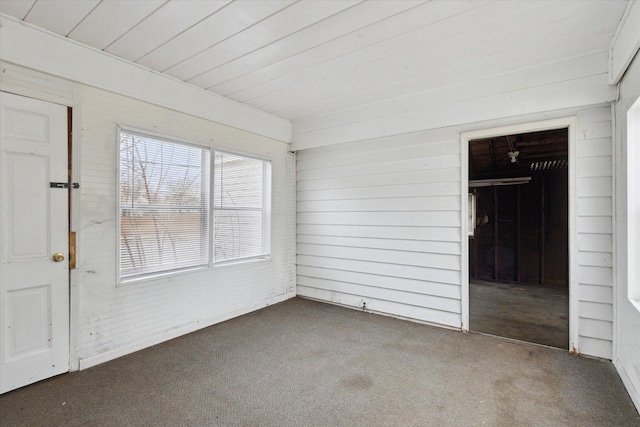 unfurnished sunroom featuring wood ceiling