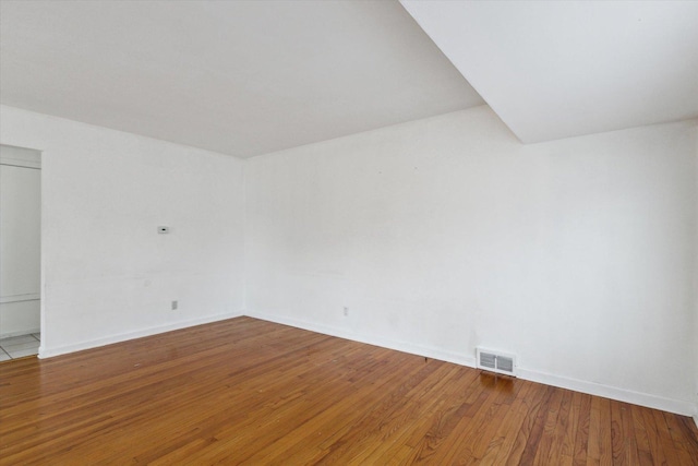 unfurnished room featuring hardwood / wood-style floors