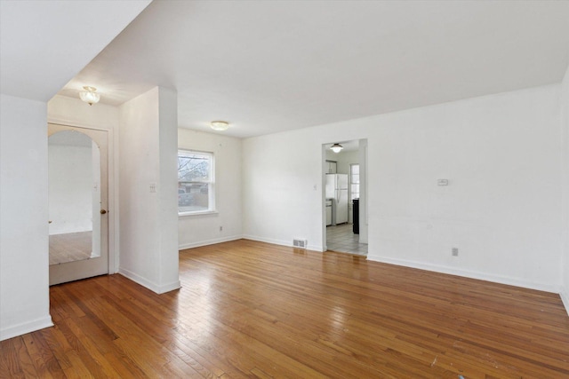 unfurnished living room featuring wood-type flooring