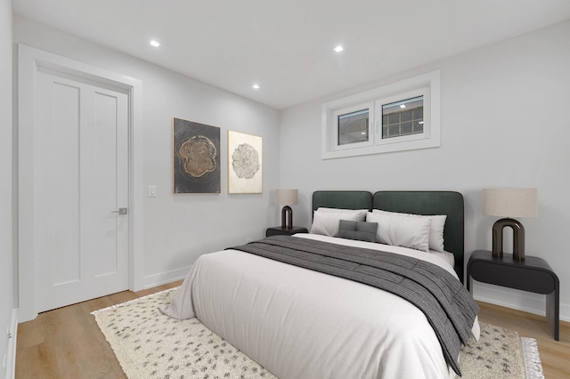 bedroom with light hardwood / wood-style floors