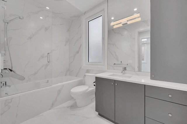 full bathroom with tiled shower / bath combo, vanity, and toilet