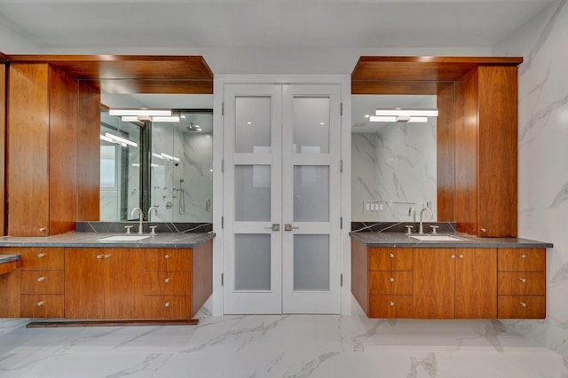 bathroom with vanity and a shower with door