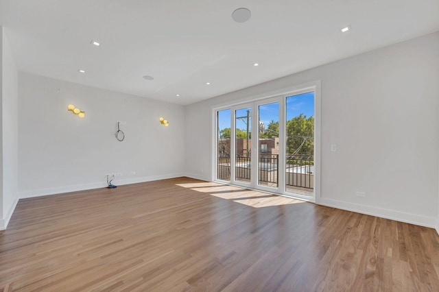 spare room featuring light hardwood / wood-style flooring