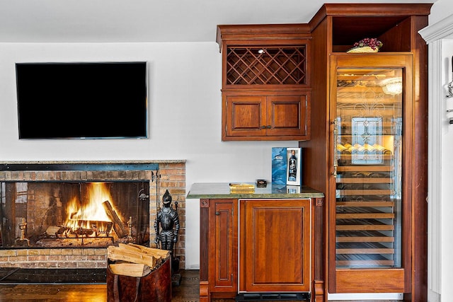 bar featuring a brick fireplace