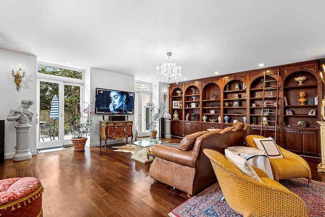 living room featuring an inviting chandelier and wood-type flooring