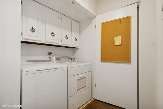 washroom with cabinet space and washer and dryer