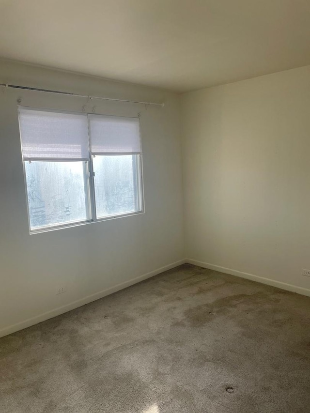 empty room featuring light carpet