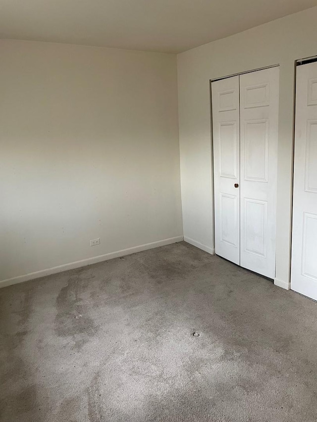 unfurnished bedroom with carpet