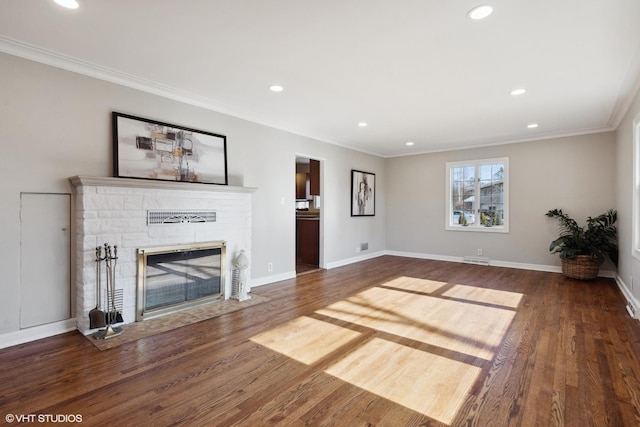 unfurnished living room with crown molding and dark hardwood / wood-style flooring