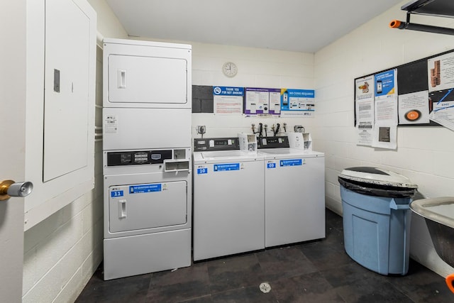 laundry room with separate washer and dryer and stacked washer / drying machine