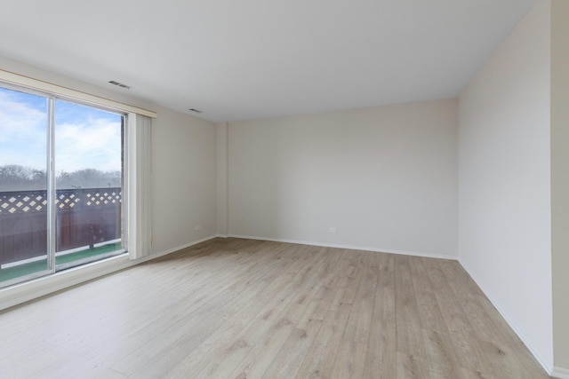 empty room with light hardwood / wood-style floors