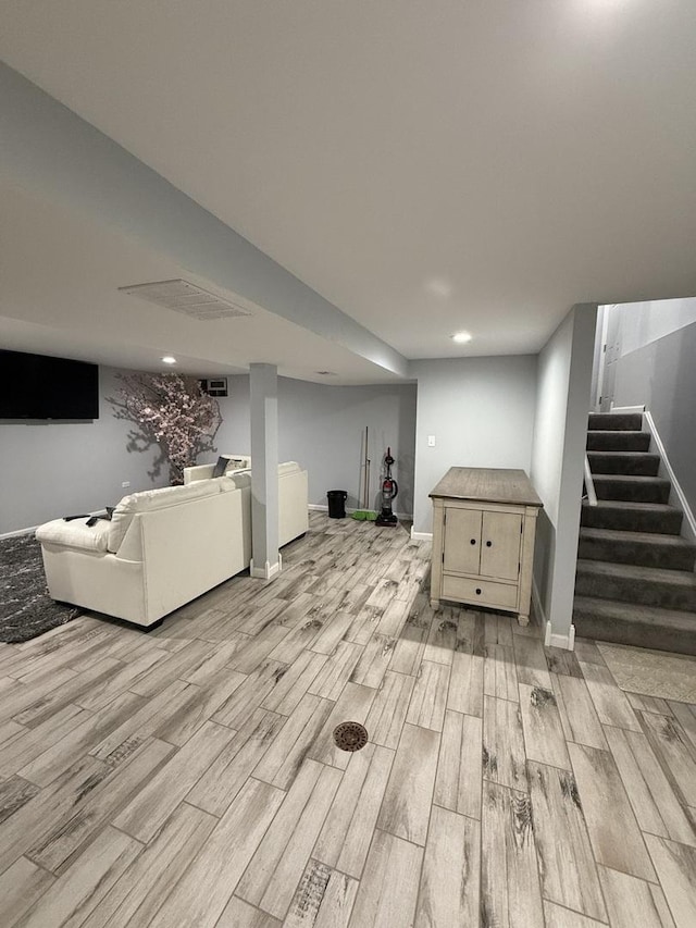 basement featuring light wood-type flooring