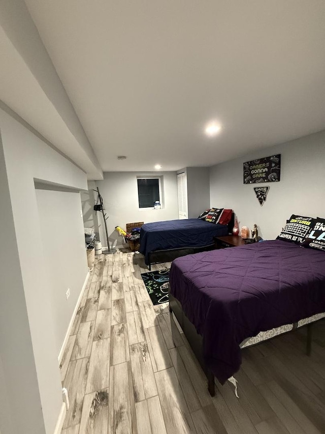 bedroom with hardwood / wood-style floors