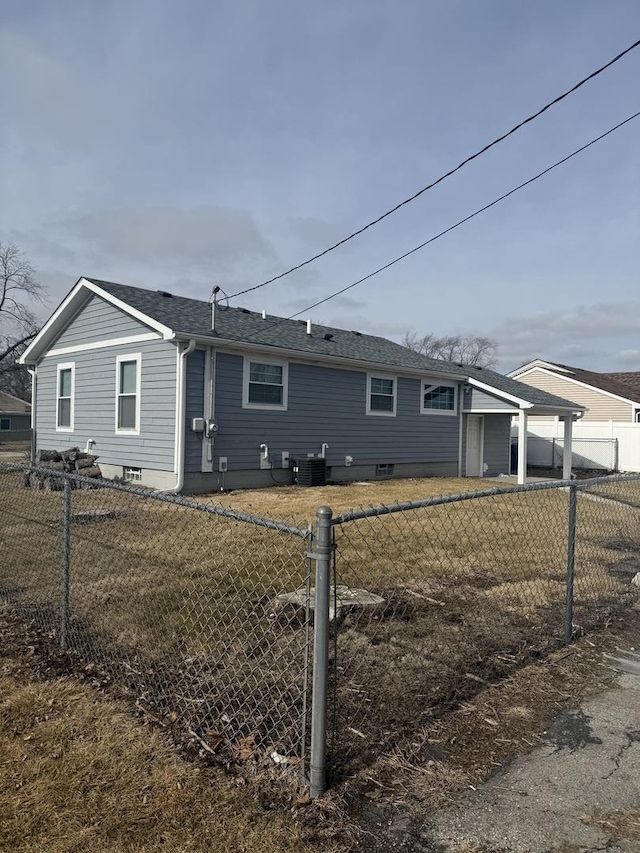 view of side of property with a yard and central AC unit