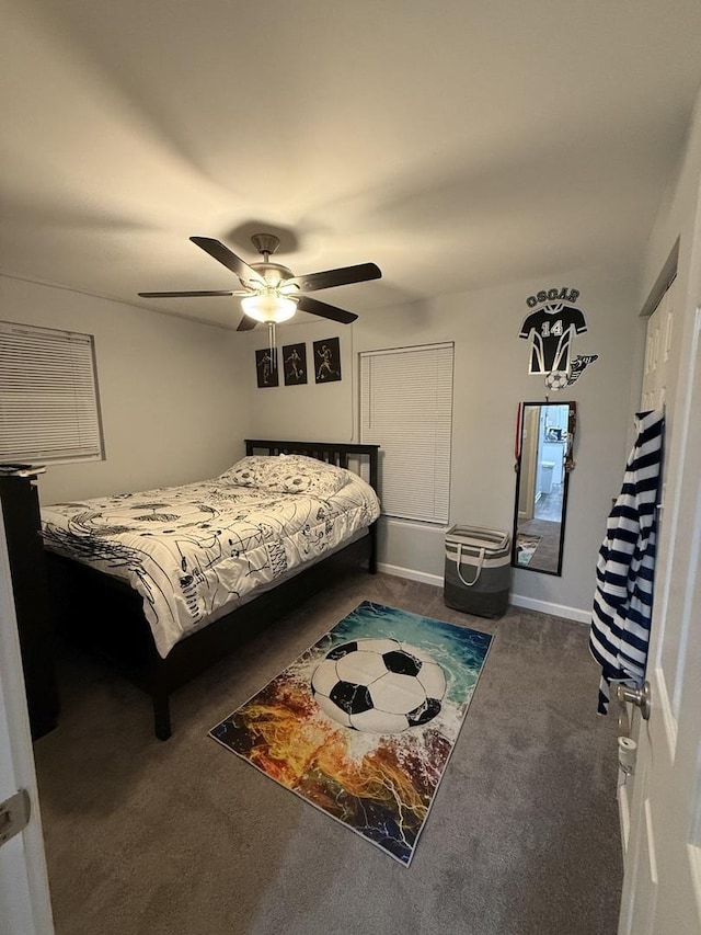 bedroom featuring dark carpet and ceiling fan