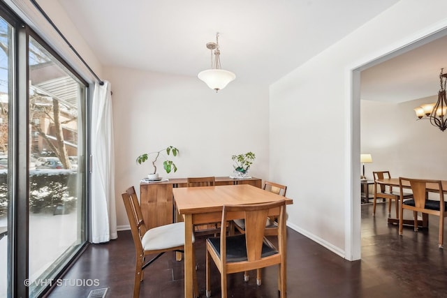 dining space featuring a chandelier