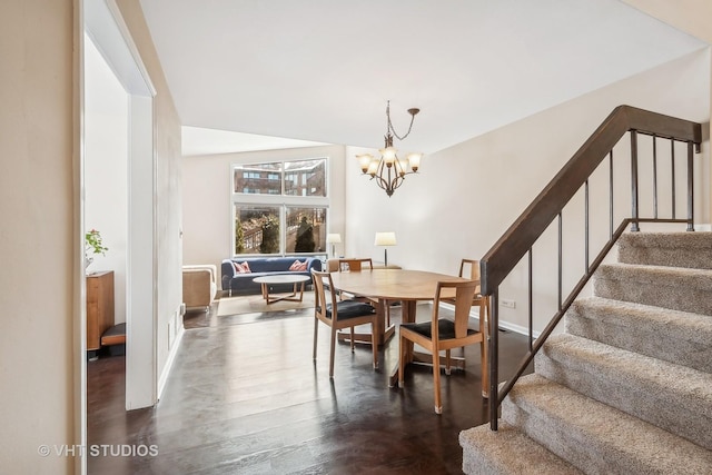 dining room with a chandelier and dark hardwood / wood-style floors