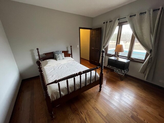 bedroom with wood-type flooring