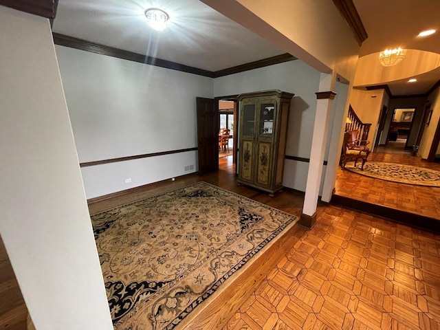 hallway featuring ornamental molding and parquet flooring