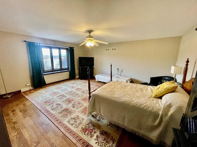 bedroom featuring hardwood / wood-style flooring and ceiling fan