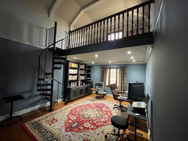 living room featuring hardwood / wood-style flooring, crown molding, and high vaulted ceiling