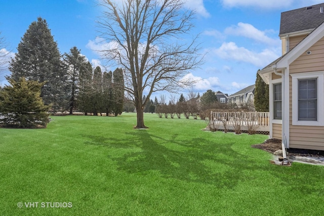 view of yard with a wooden deck