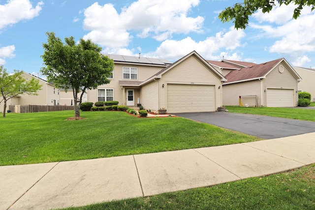 1711 Fallbrook Dr, Hampshire, IL 60140 - traditional-style house with solar panels, a garage, and driveway