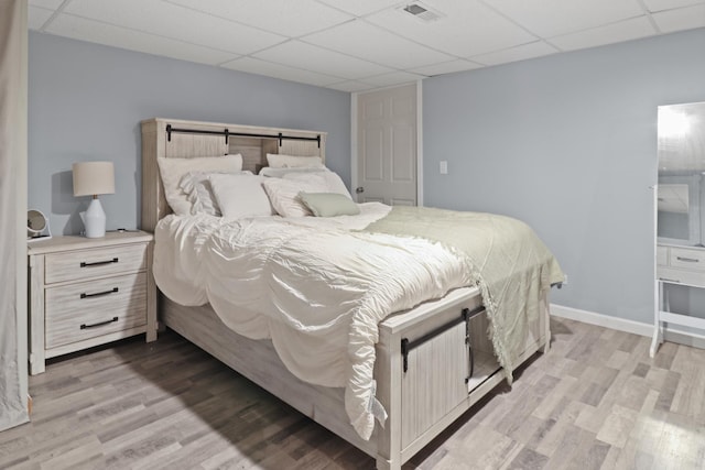 1711 Fallbrook Dr, Hampshire, IL 60140 - bedroom with light wood-type flooring, a drop ceiling, and baseboards