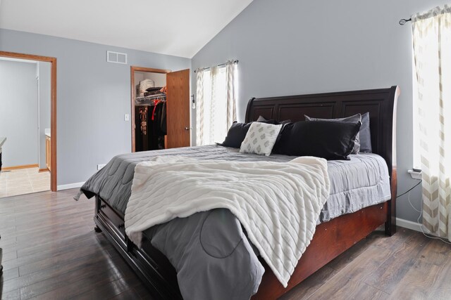 1711 Fallbrook Dr, Hampshire, IL 60140 - bedroom with lofted ceiling, wood finished floors, baseboards, a closet, and a spacious closet