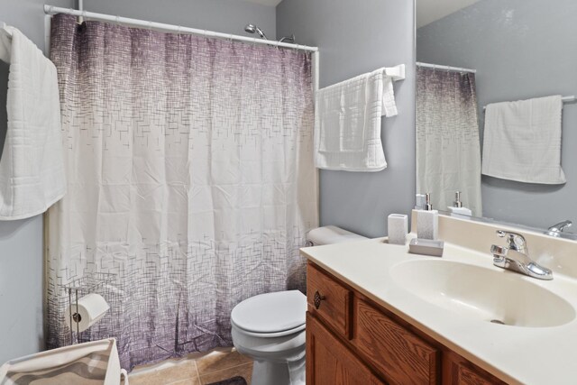 1711 Fallbrook Dr, Hampshire, IL 60140 - bathroom with toilet, vanity, tile patterned floors, and a shower with shower curtain