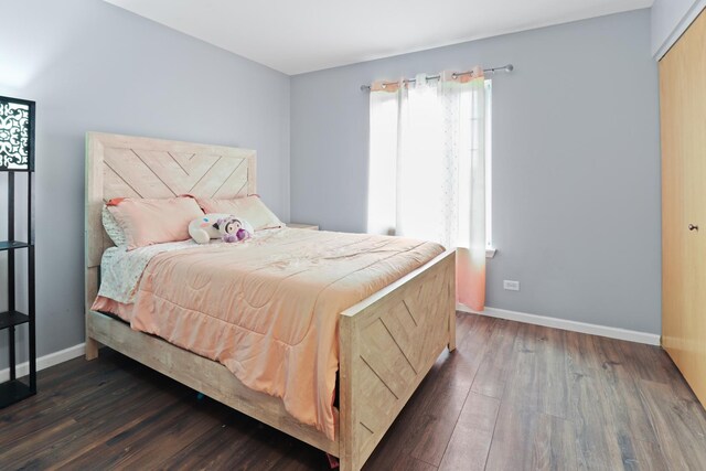 1711 Fallbrook Dr, Hampshire, IL 60140 - bedroom featuring multiple windows, dark wood finished floors, and baseboards