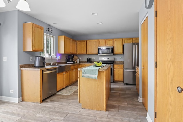 1711 Fallbrook Dr, Hampshire, IL 60140 - kitchen featuring stainless steel appliances, a kitchen island, a sink, baseboards, and recessed lighting