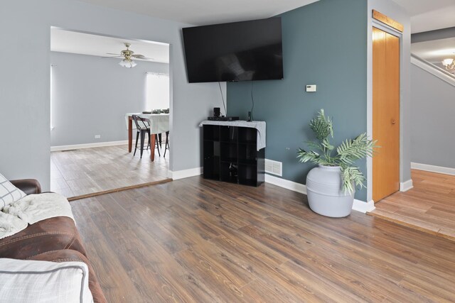 1711 Fallbrook Dr, Hampshire, IL 60140 - living room featuring wood finished floors, a ceiling fan, and baseboards