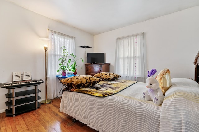 bedroom with hardwood / wood-style floors