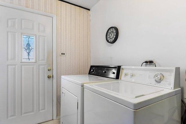 clothes washing area featuring washing machine and dryer