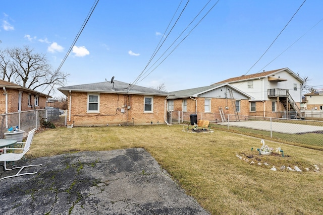 rear view of house with a lawn