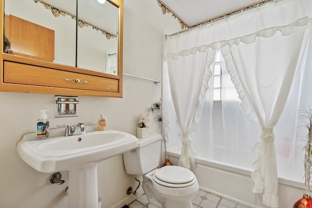 full bathroom with sink, shower / tub combo with curtain, and toilet